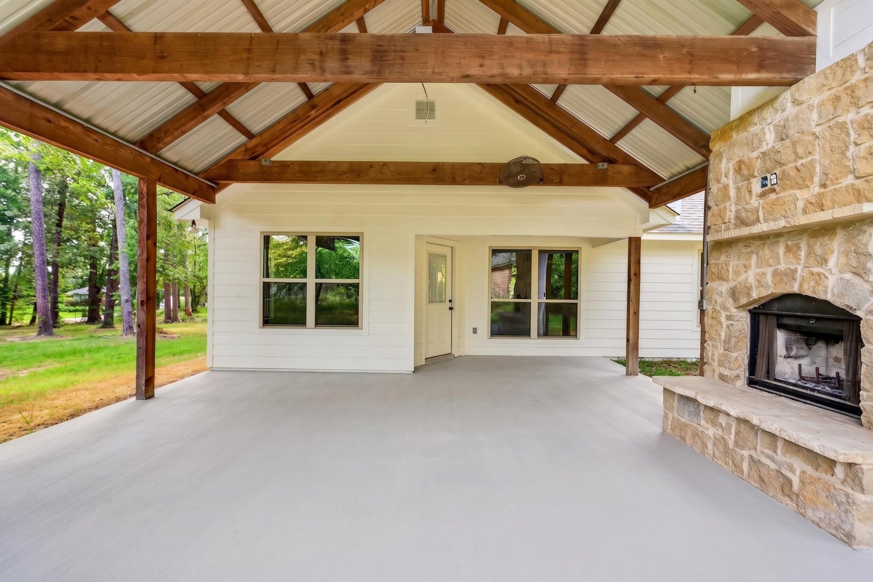 Covered patio with fireplace at 6110 Club Drive
